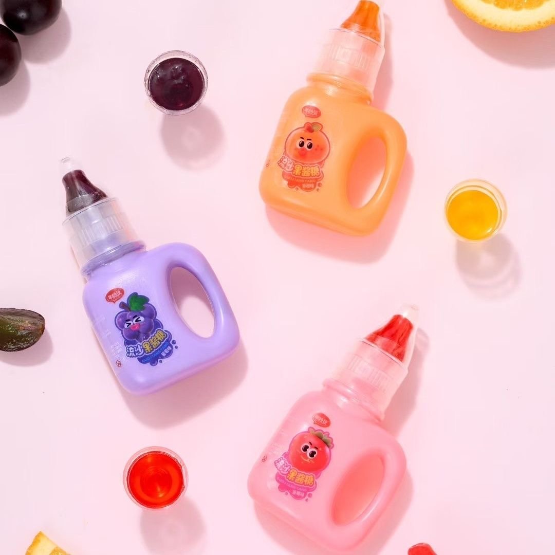 Fruit flavored jam filled hard candy in baby bottle and nipple design